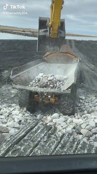 Exploring Riprap with Heavy Equipment at Construction Site