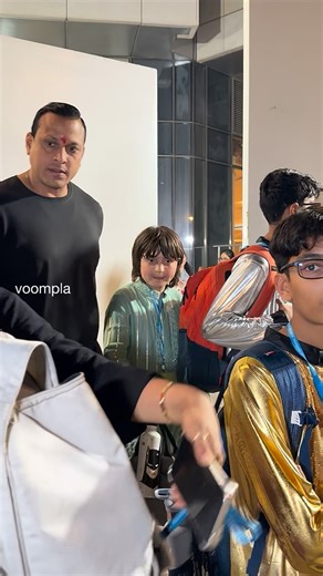 Voompla on Instagram: "srk’s son abram and ravi (the family’s bodyguard) make their way out of a school’s annual day in bkc"
