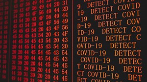 Covid-19 red alert in codes on the screen - Free Stock Video