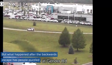 Car escapes traffic by driving backwards, then keeps going