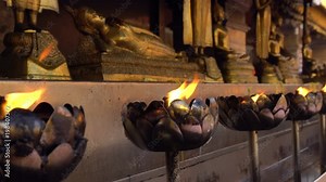 Lotus Bowl with Burning Oil Incense for Praying Buddha gods to show respect. Sacred Flame