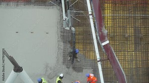 building a floor by pumping liquid concrete for Concreting on a construction site