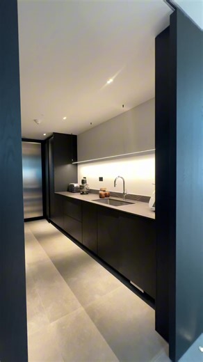 Designed as a hidden zone behind a statement door, this hidden walk in pantry becomes a place to organise freely, without the worry of visible clutter when time is limited. #NicholasAnthony #NicholasAnthonyinteriors #luxurykitchens #londonbusiness #luxurylifestyle #kitchenisland #signaturerange #heartofthehome #interiors #interiordesign #visitlondon #luxurylifestyle #lifestyle #luxuryinteriors #luxurydesign #kitchengoals