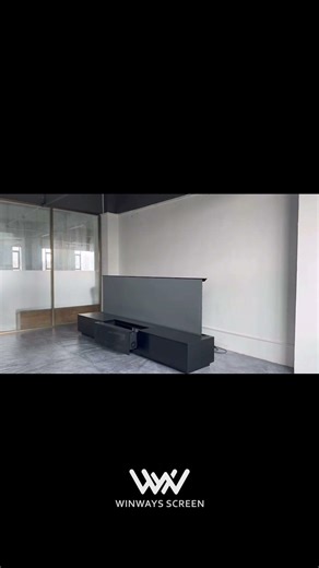 Watch this **120-inch Fresnel electric rising projector screen** slowly lift from the ground.