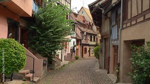 Eguisheim has picturesque cobbled streets admiring colorful houses with pointed roofs and timber-framed facades which makes visitors feel like in a real-life fairytale