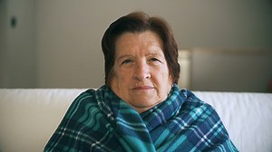 Sick old woman shivering with a blanket around her shoulders - Free Stock Video