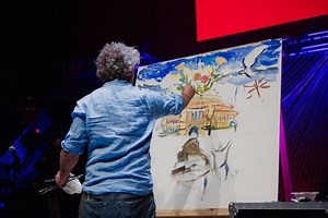 '...all I could see when I painted this building was this, exactly this. I could see hundreds of people, and I had never seen people worship before, but this is what I saw. It's very odd, it's beautiful to see it come to fruition' Charlie Mackesy speaks about the Royal Albert Hall whilst painting live on stage. | HTB Church