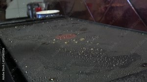 4k, cheff is cooking a Steak in hot Griddle of a kichen, T-bone steak is low fat healthy living meal choice -Dan