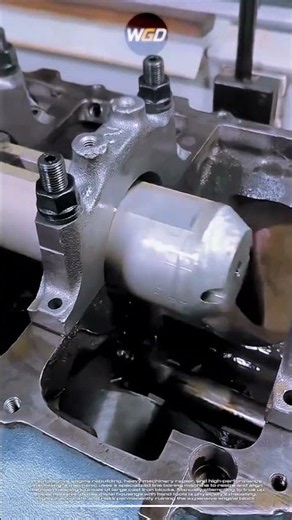 Clever mechanic resize components using line boring machine for perfect automotive engine rebuilding