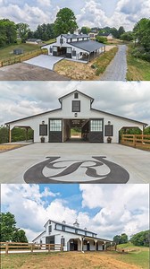 This modern Monitor Barn is an absolute STUNNER! Set against a scenic, rolling countryside the barn features a clean, contemporary design with a white exterior and black roof, giving it a striking contrast. Its centerpiece is the large, central section with a raised roofline typical of monitor barns, allowing for extra ventilation and natural light. The barn is surrounded by green pastures, with a gravel driveway leading up to it, making it an ideal structure for a functional yet stylish equestr