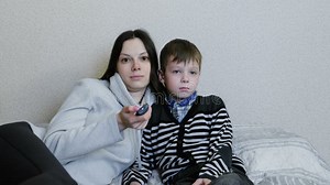 Watching TV Lying on the Couch. Mom and Son Watch TV Together and Smile. Mom Switches Channels. Stock Video - Video of cartoon, couch: 114675221