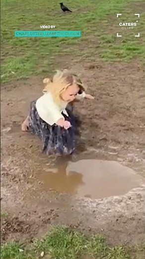 Toddler Falls In A Puddle