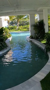 1.7K views · 3.6K reactions | This pool has an insane lazy river underneath the home! It also features an elevated spa with an infinity edge that spills over a natural coral waterfall into the main pool below. #insanepools #lucaslagoons | Lucas Lagoons Design | Facebook