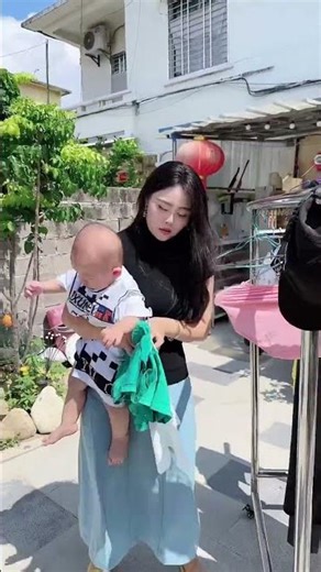 Mother's illusion from baby care makes her rock air with arms