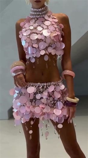 Share with a friend who would own the spotlight in this blush pink corset mini set! To order, send