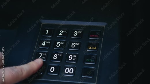 Close-up of ATM keypad as a bank customer enters a PIN code using fingers. The scene represents banking security, cash withdrawal, and digital financial transactions. High quality 4k footage