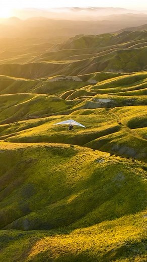 National Geographic on Instagram: "Video by @chrisburkard | After significant rainfall in California’s 2022-23 winter, which harked back to record-setting precipitation in 1982-83, an eruption of wildflowers now paints the hills yellow, blending with the sunlit slopes. Aviator and photographer Chris Bredine soars above the bloom near Carrizo Planes in an ultralight aerial trike, providing an unparalleled field of view—though exposure to cold winds can make camera operation tricky. The experiment