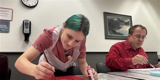 ‘Art is therapeutic’: Providence Alaska paint ‘Peanuts’ murals during Peanuts Worldwide Paintfest