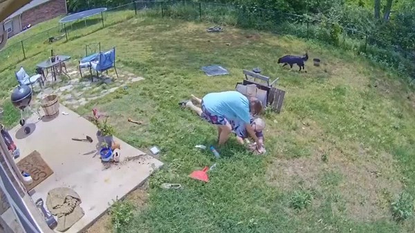 Man Stumbles and Falls In Yard With Barbecue Grill Over Him