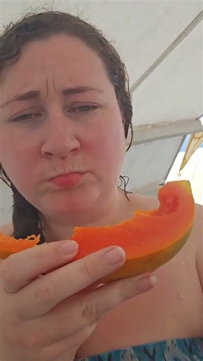 Trying a papaya for the first time while we were island hopping in the Britania Islands 🇵🇭 #papaya