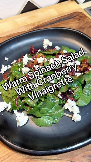 Warm Spinach Salad with Cranberry Vinaigrette #christmas #easyrecipe #videotutorial #saladrecipe #vinaigrette #holidaysalad #wintersalad Recipe 1 sliced large shallot 1 teaspoon minced garlic 1 cup dried cranberries 1/4 cup red wine vinegar 1 cup cranberry juice 1 tablespoon dijon Salt and Pepper Salad 2 handfuls baby spinach 2 tablespoons of sliced red onion 2 tablespoons dried cranberries 2 tablespoons toasted walnuts 2 tablespoons chopped crispy bacon 1 tablespoon of Humboldt Fog Blue Cheese