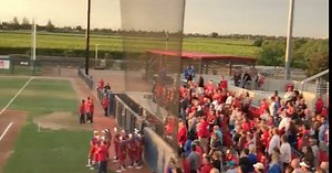 Crowd sings national anthem