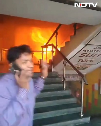 A fire broke out at a building in Noida Sector-18 on Tuesday afternoon. Joint Commissioner of Police Shiv Hari Meena spoke to ANI and said, "We received information about the fire at Sector 18, Krishna Plaza in Noida. We arrived with fire services and doused the blaze in a few minutes. People were evacuated, and those feeling unwell were sent to the hospital for treatment." | NDTV