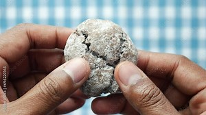 hand breaking sweet chocolate cookies
