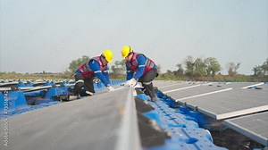 Photovoltaic engineers work on floating photovoltaics. Inspect and repair the solar panel equipment floating on the water.