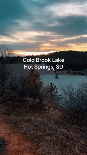 Cold Brook Lake – Hot Springs, South Dakota 🧊 Nestled under the Black Hills, Cold Brook Lake is serene even when the water is frozen. The ice reflects the sky, creating a calm, peaceful escape where you can pause, breathe, and enjoy the quiet beauty of nature. A hidden gem just minutes from Hot Springs, it’s the perfect spot to relax, reflect, and take in the tranquil magic of the Black Hills, whether the lake is iced over or sparkling in the sun. #lakes #placestovisit #outdoorfun #justbreathe 