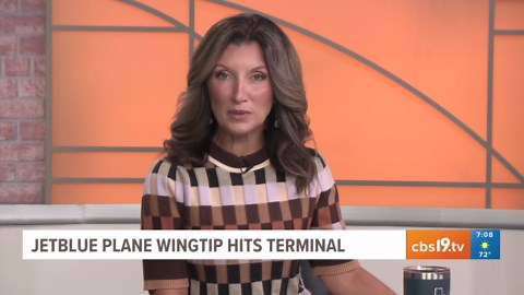 JetBlue wingtip hits terminal