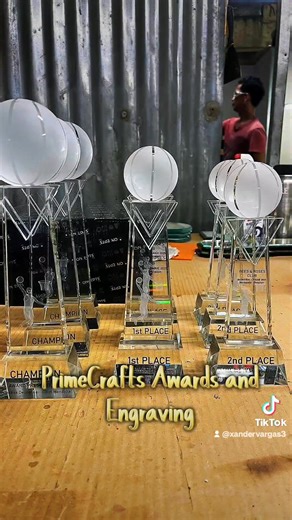 MAKE EVERY ACHIEVEMENT STAND OUT WITH PREMIUM AWARDS & CUSTOM TROPHIES. We create custom awards and precision engraving that turn recognition into a powerful statement of success, excellence, and credibility. From executive crystal awards, metal and glass plaques, acrylic trophies, medals, to custom gold trophies, each piece is expertly crafted using premium materials and professional engraving techniques. Designed to impress on stage, in offices, and during milestone celebrations. 🏆 Tailor-mad