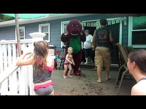 Zoe gives "Barney" a hug