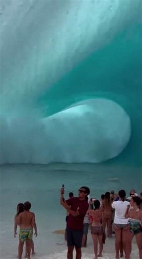 Giant Wave Engulfs Beach Crowd #BigWave #OceanPower