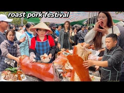 Tourists flock to buy the best whole roasted pork at the festival where hundreds of pigs are sold.