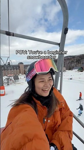 Beginner snowboarder getting off ski lifts