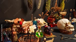 Altar of the witch for magic practices. Black long candles for occult fortune telling and rituals. Esoteric, wicca and occult background with magic objects for divination ritual, Mystic background.