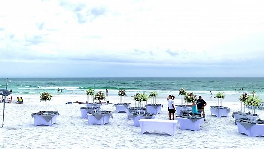 Setting up for a Gorgeous ceremony and reception on the beach🌴 | Seashell Wedding Company: Destin, Florida Beach Weddings