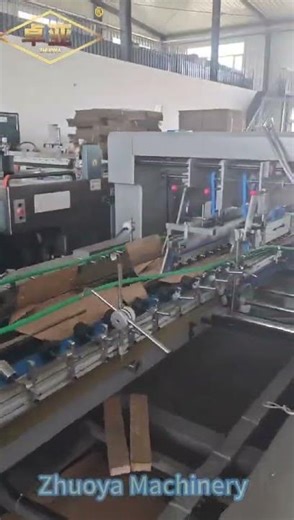 Automatic carton gluing machine