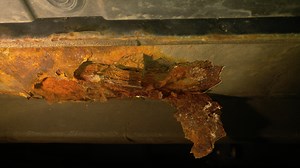 Rust hole underneath driver seat