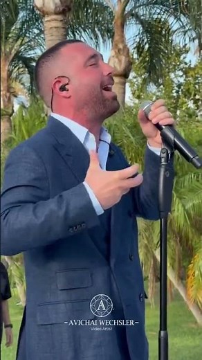 Omer Adam singing by a chuppa