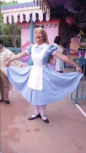 Alice teaches her friends how to curtsy at Hong Kong Disneyland