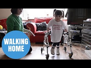 Brave Georgie Gibbs takes first steps back home following operation