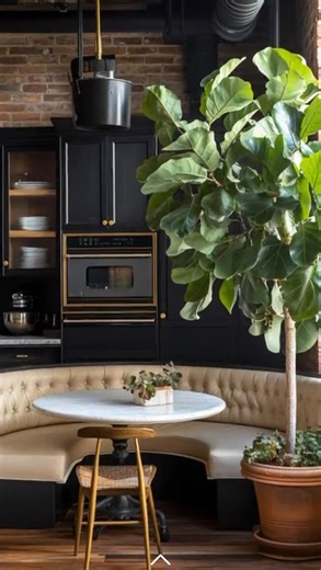 Elegant & Driven on Instagram: "Create restaurant-style living at home with a beautifully designed dining booth that instantly elevates modern spaces. Built-in booths add structure, comfort, and quiet luxury—whether you choose a round booth for intimate dinners, a square booth for everyday dining, or a corner booth to maximize small spaces. Styled with black kitchen appliances, warm wood tones, and sculptural greenery, this setup works effortlessly as a dining table, casual lounge, home workstat