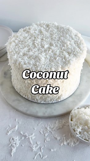 New recipe! Coconut cake! This coconut cake is made with coconut extract, coconut milk, coconut buttercream frosting, and shredded coconut for a coconut overload! Recipe linked in my profile and on cakemehometonight.com! #coconut #cake #coconutcake