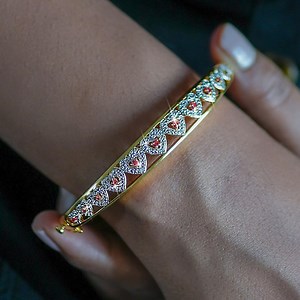 With 12 dazzling rubies, the I Love You Ruby & Diamond Bangle is the perfect jewelry to take on life's adventures! | The Danbury Mint | Facebook
