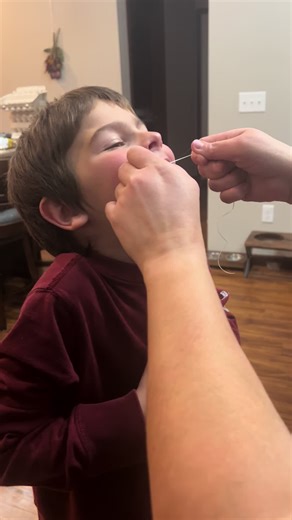 The best way to get a loose tooth out imo!! My baby boy is losing his front teeth🥺 why do they have to grow up so fast! #momlife #dental #teeth #looseteeth #losingteeth #babyteeth #momsoftiktok #mom #momsover30 #momhack #motherhood #motherhoodunfiltered #motherhoodunplugged #motherhoodbelike