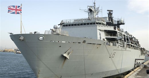 Royal Navy warship emerges from giant shipbuilding hall