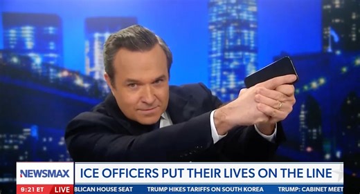 Newsmax Host Holds His Phone Like a Firearm in Defense of ICE Agents Who Shot Alex Pretti: ‘Does That Look Like a Gun?’