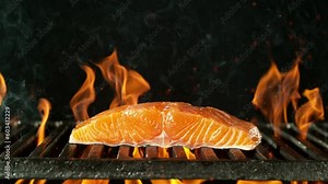 Super Slow Motion of Salmon Steak Falling on Grill. Filmed on High Speed Cinema Camera, 1000 fps, Placed on High Speed Cine Bot, Tracking the Target. Speed Ramp Effect.